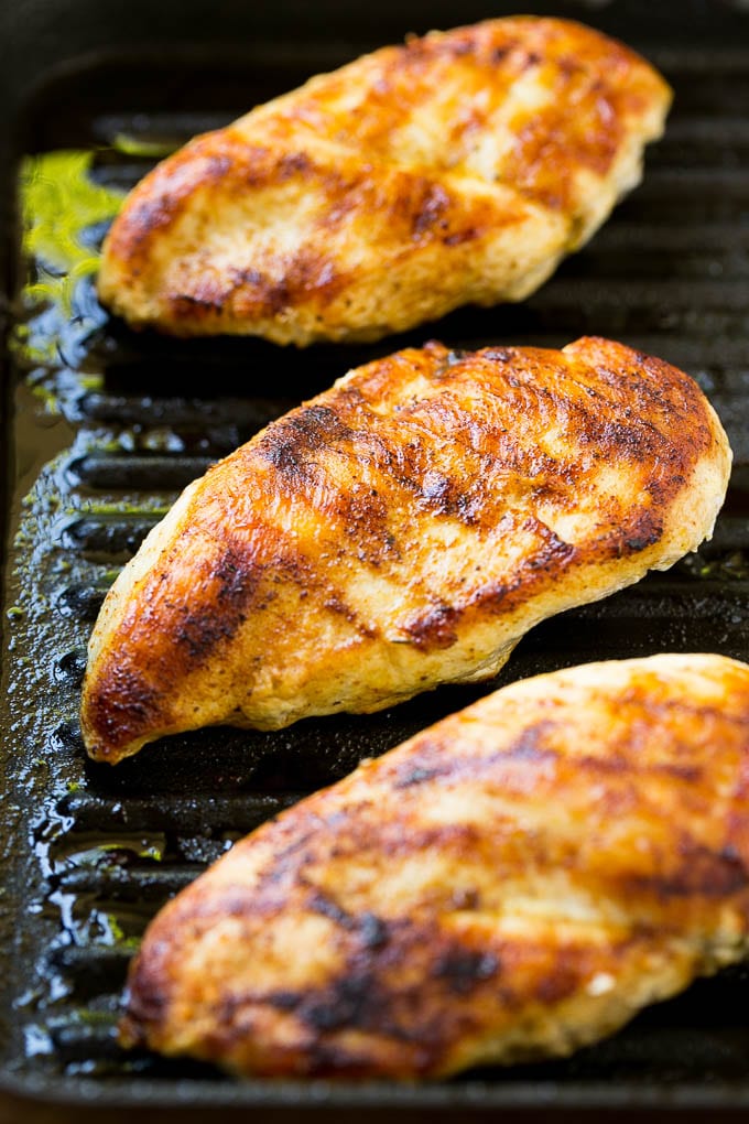 Cooked chicken in a grill pan.