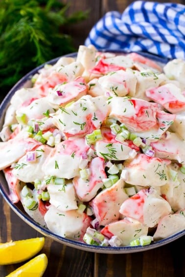 Creamy crab salad with fresh vegetables and dill in a mayonnaise dressing.