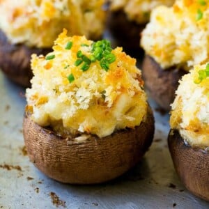 Crab stuffed mushrooms with cremini mushroom caps filled with a creamy seafood filling.