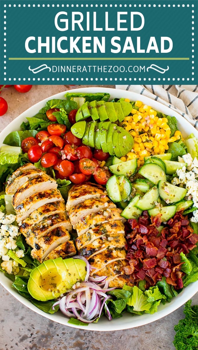 This grilled chicken salad is tender marinated chicken that's grilled to perfection then served over lettuce with bacon, avocado, corn, blue cheese and tomatoes.