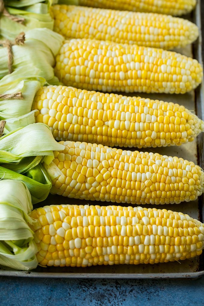 Corn cobs on a sheet pan.