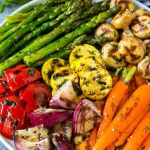 A colorful platter of grilled vegetables flavored with garlic and herbs.