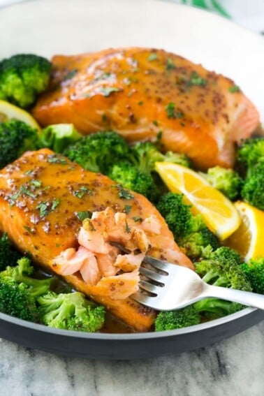 This recipe for honey mustard salmon is seared salmon fillets coated in a sweet and tangy honey mustard sauce. Add broccoli to make a one pot meal!