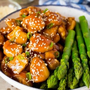 Instant Pot teriyaki chicken served with asparagus.
