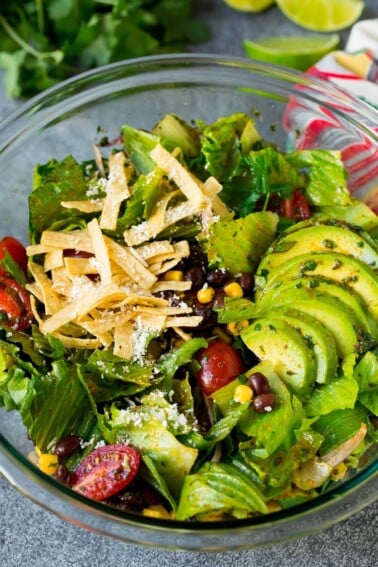 Mexican salad with lettuce, corn, beans and tomato, tossed in a lime dressing.