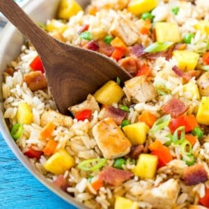 This recipe for pineapple fried rice is loaded with chicken, bacon, crunchy veggies and juicy pineapple. A simple and easy main course or side dish that's MUCH better than take out! #Back2SchoolSuccess #ad