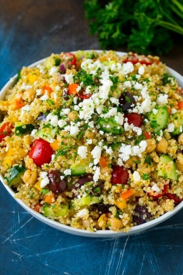 Quinoa salad with tomatoes, cucumbers, peppers, onions and olives.