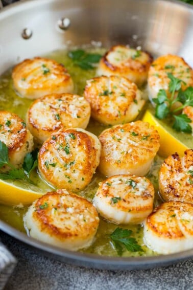 Seared scallops in a lemon garlic sauce with fresh parsley.