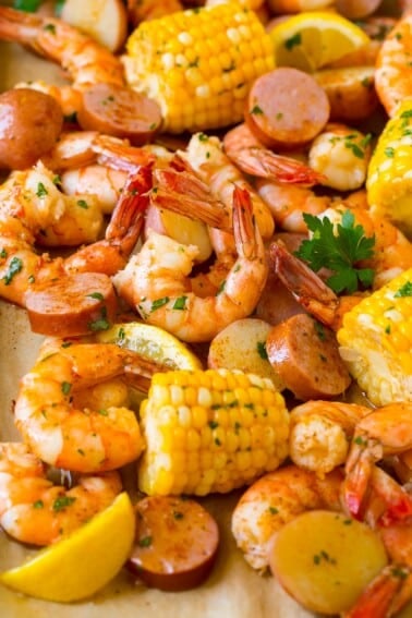 A pan of shrimp boil made with corn, potatoes and sausage.