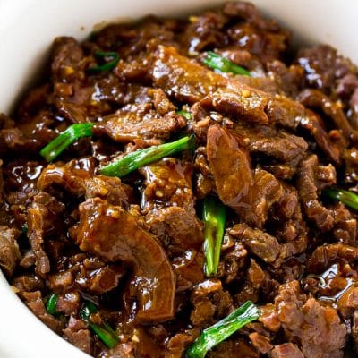 Slow cooker mongolian beef with thinly sliced flank steak cooked with soy sauce, brown sugar, garlic and ginger.