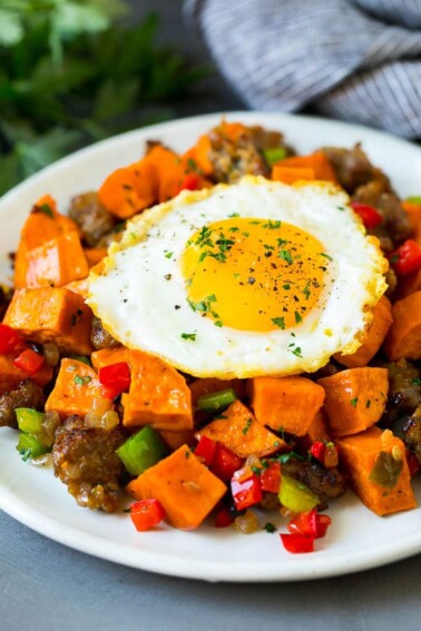 Sweet potato hash with sausage, topped with a fried egg.
